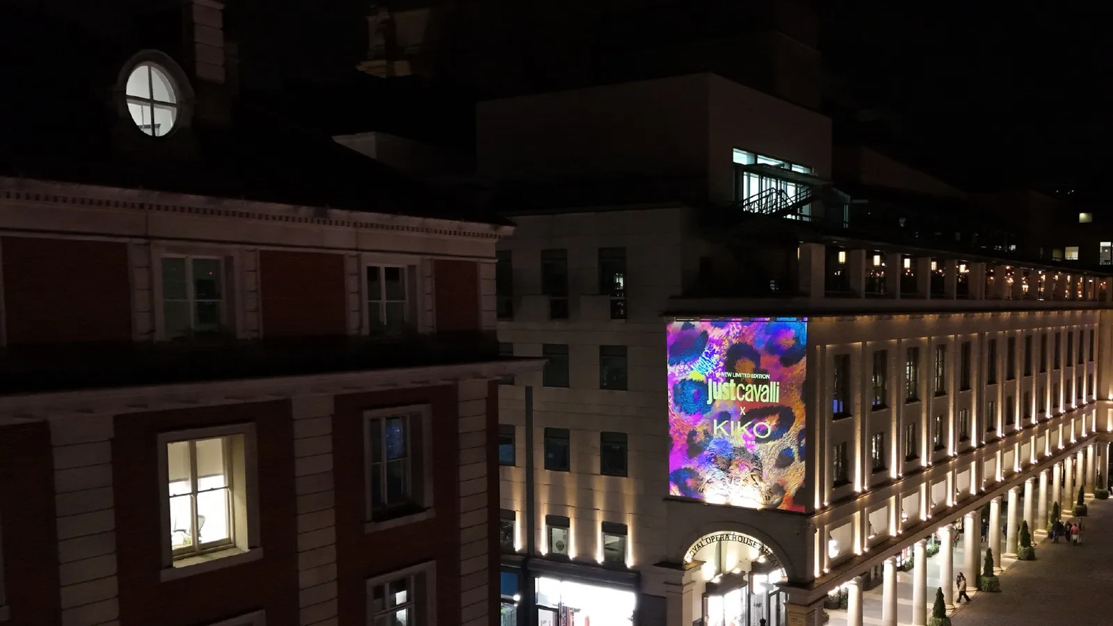 Projection mapping visual content on an architectural facade at night